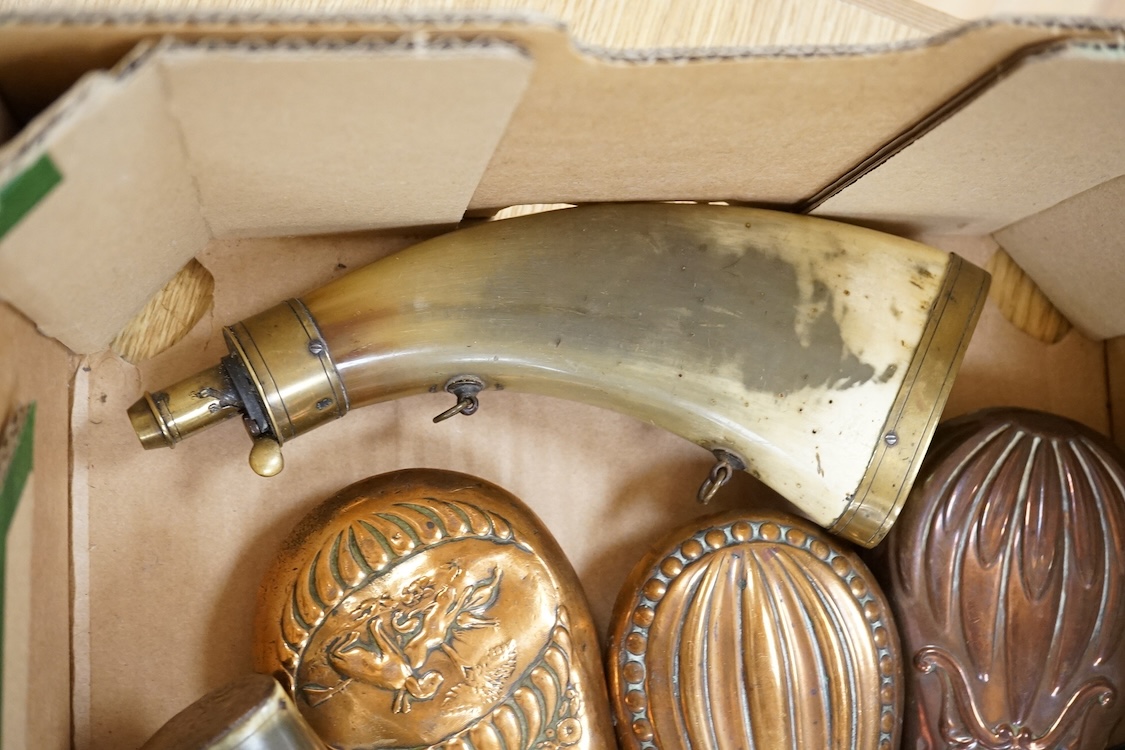 Nine powder flasks and shot flasks, all 19th century, comprising of two horn flasks, one flattened with brass mounts, three shot bags with sprung brass chargers, three copper gun flasks and another of zinc